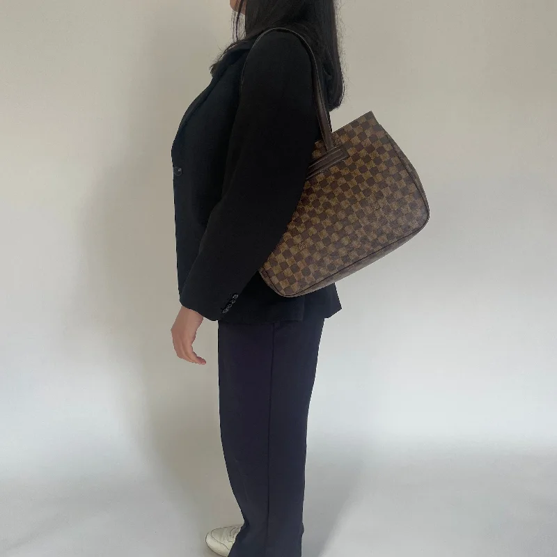 Louis Vuitton Twist bags with a snakeskin - effect panel for a bold lookLouis Vuitton Damier Ebene Chelsea