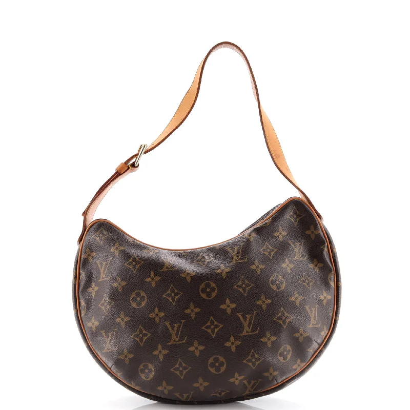 Louis Vuitton Twist bags with a crystal - embellished LV - turnlockCroissant Handbag Monogram Canvas MM