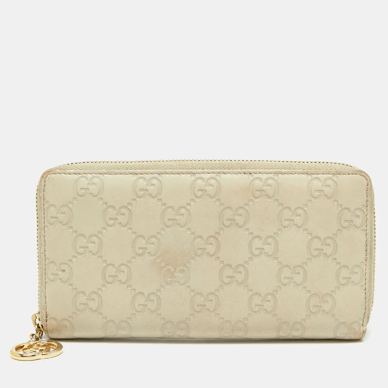 Gucci crossbody bags for women with adjustable leather strapsGucci Beige Guccissima Leather Zip Around Wallet