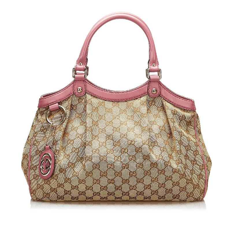 Gucci Marmont bags for women with gold - toned hardwareGucci GG Canvas Sukey