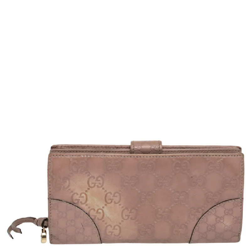 Gucci handbags for women with a back - zip pocketGucci Beige Guccissima Leather Bree Bifold Wallet