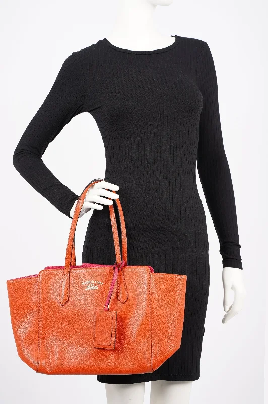 Women Gucci Sylvie bags featuring the signature web stripeGucci Womens Swing Tote Burnt Orange